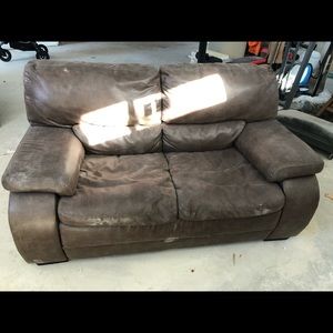 Brown leather couch and love seat